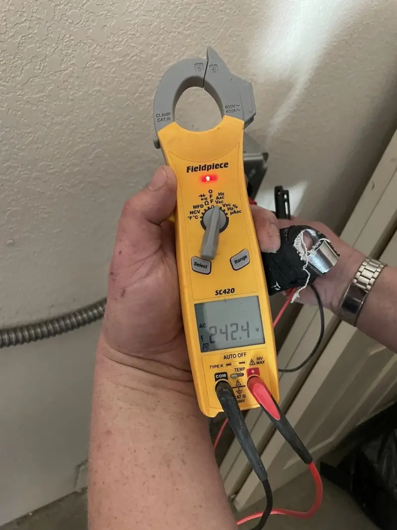 Voltage testing with clamp meter during Recessed Lighting Installation in Liberty